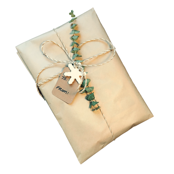 Hand stamped kraft paper gift wrap featuring hand drawn leaf + paintbrush  designs, twine + gift tag — Cafe Notes + Company