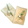 Eco-friendly natural Kraft paper gift wrapping with jute cord, handmade charms and recycled paper gift tag